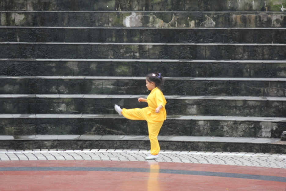 Tanzen in Quongqing auf dem Hauptplatz